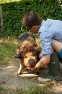 beautiful ginger black kune dune with owner